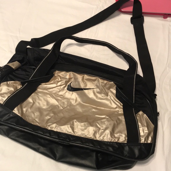 gold nike bag